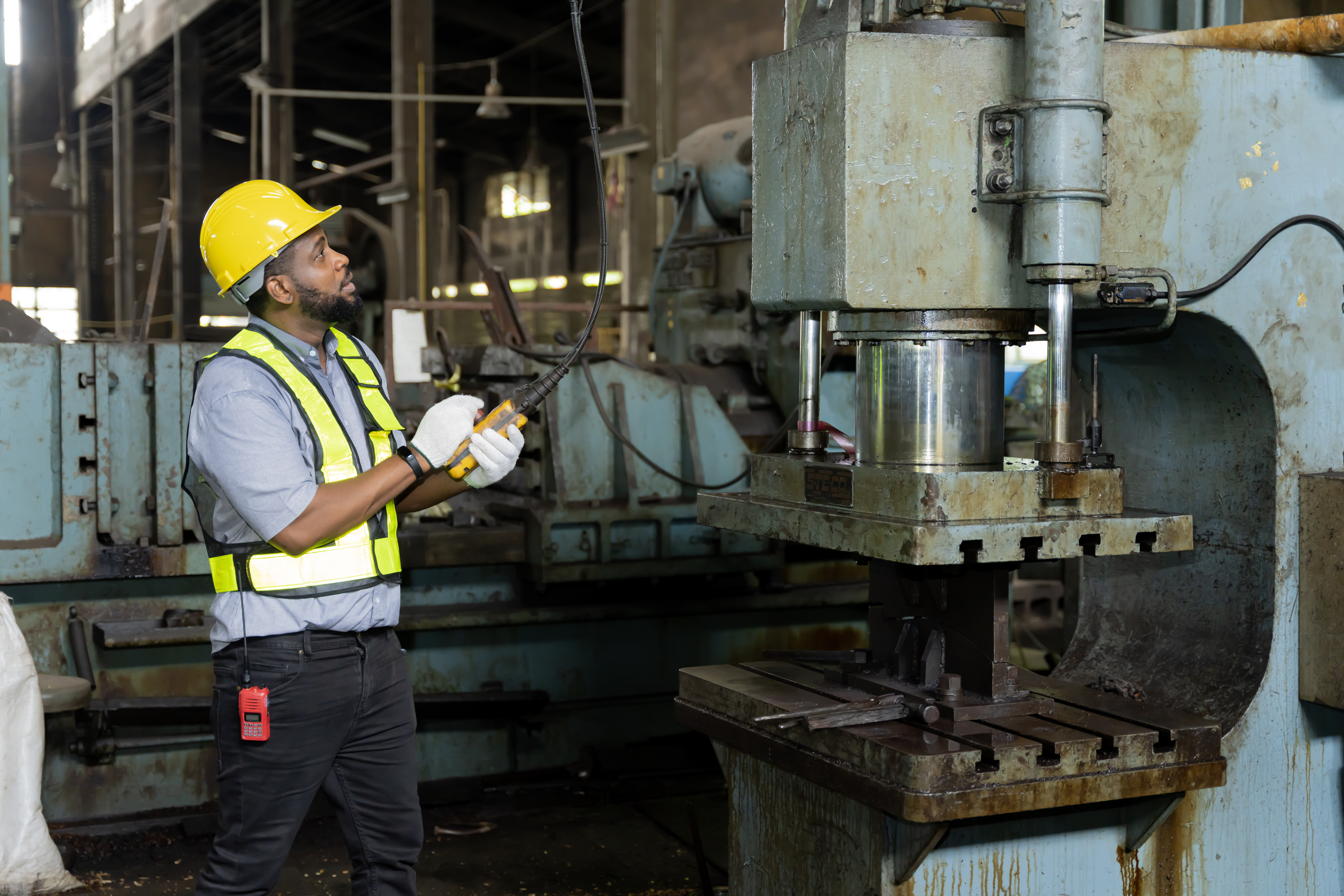 A businessman maintenance work at an old factory 2023 11 27 05 27 58 utc
